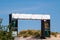 Large blank white banner over entrance to a beach