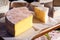 Large block of fresh cheese at an outdoor market