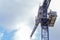 Large blue crane on a construction site on a commercial development with sky in the background