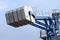 Large blue crane on a construction site on a commercial development with sky in the background