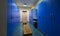 Large blue lockers and wooden bench