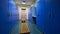 Large blue lockers and wooden bench