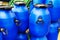 Large blue polymer drums. Plastic products for storing and transporting liquids. Close-up