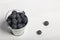 Large blueberries in a decorative bucket. International day without diets. On a white background. Close-up