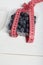 Large blueberries in a decorative bucket. Measuring tape for measuring the waist. International day without diets. Close-up