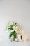 Large bouquet of white spring flowers in a vase, daffodils, tuli