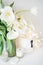 Large bouquet of white spring flowers in a vase, daffodils, tuli