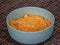 Large bowl with cooked Morocco Couscous mixed with olive oil and paprika powder