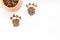 Large bowl of pet - dog food spilling in paw print on white background top view mockup