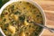 A large bowl of Zuppa Toscana made with sausage, potatoes, kale and red pepper in a creamy chicken broth.