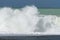 Large breaking waves on shingle foreshore