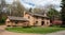 Large Brick Two-car Garage Home with Flowering Crabapple Trees