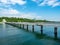 A large bridge with a pier and jumping and walking people in Burgas, Bulgaria