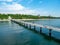 A large bridge with a pier and jumping and walking people in Burgas, Bulgaria