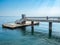 A large bridge with a pier and jumping and walking people in Burgas, Bulgaria