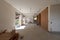 Large bright room with windows of an ancient villa undergoing renovation. The old walls have been torn down and new ones have been