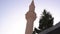 Large brown brick minaret top of mosque famous landmark