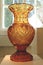 A large brown crystal vase
