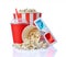 Large bucket and small cup of appetizing salty popcorn with 3d anaglyph glasses and beverage