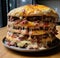 a large burger with cheese and meat on top