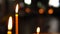 Large burning candle in close-up focus