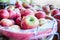 Large bushel basket full of fresh locally grown red apples at lo