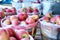 Large bushel basket full of fresh locally grown red apples at lo