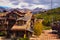 Large cabin housing in the mountains with hills of aspen in background