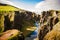 Large canyon with cliffs and a river in Iceland. Fjaorargljufur canyon in Iceland
