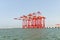 Large cargo cranes stand on a pier in the Mediterranean port of Haifa in Israel