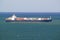 Large cargo ship bringing cargo containers to Durban, South Africa on the Indian Ocean