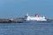 Large cargo ship navigating to the harbor in Varberg