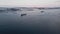 Large cargo ships sail along the bay near the northern seaport.