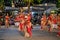 large carnival festive procession with elephants and dancers in bright national costumes through the streets of Colombo