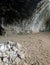 large cave in the rock used as a dwelling by primitive men