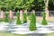 Large chess pieces decorated with green grass