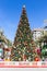 Large Christmas Tree in Dubai, Town Square Park, amont green palm trees.