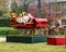 Large Christmas yard display with Santa in his sleigh filled with gifts, pulled by reindeer in Dallas, Texas