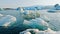 Large Chunks of Ice Float in Turquoise Glacier Lagoon in Iceland Clear Blue Icebergs Forming from a Melting Glacier