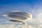 Large circular clouds Altocumulus lenticularis duplicatus in t