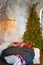 a large classic Christmas tree in the bedroom by the bed in the loft interior.