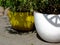 Large clay flower pots in yellow and white. abstract closeup detail.