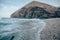 Large cliff on the beach in Playa de los Muertos, Spain