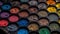 A large collection of vibrant eyeshadow colors in a row generated by AI
