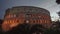 Large Colosseum illuminated with lights at twilight in Rome