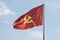 Large communist flag floating in the wind