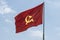 Large communist flag floating in the wind