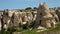 A large cone-shaped rock formation with stairs