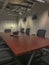 Large conference room table with black chairs