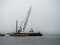 Large Crane Dredging the Winchester Bay in Oregon.